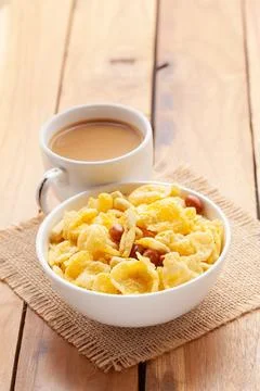 Close-Up of crunchy Indian Cornflex mixture snacks with hot tea or Coffee. Stock Photos
