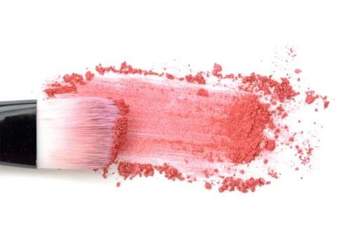 Close up of crushed blush on white background and cosmetic brush Foto stock