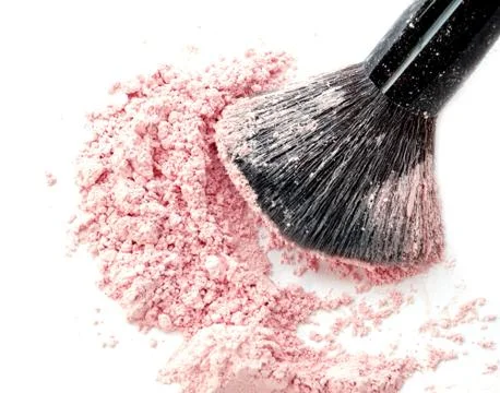 Close up of crushed blush on white background and cosmetic brush Stock Photos