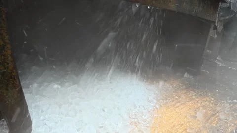 Close Up of Crushed Ice Falling from Industrial Ice Crushing Machine Stock-Footage 343154913