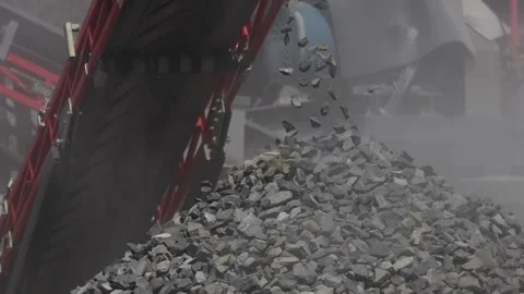 Close-up. Crushed stone falls from a conveyor belt. Production of crushed stone. Stock Footage 278015648