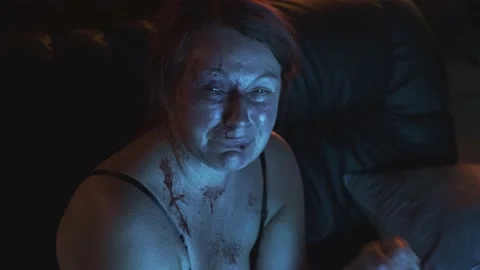 Close-up of a crying blood-beaten woman's face. Vídeos de archivo 138619829