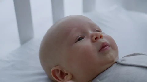 Close-up, crying newborn baby lying in bed Stock Footage 305991257