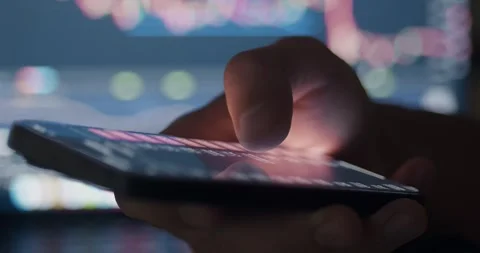 Close-up of crypto trading in mobile phone. Businessman checking bitcoin price Stock Footage 273586117