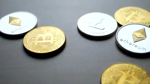 Close-up of cryptocurrency coins on a surface 库存影片 328295455