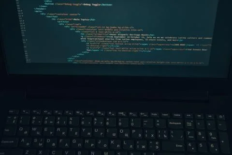 Close up css HTML code on monitor screen with black background Stock Photos