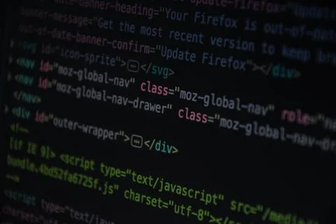 Close up css HTML code on monitor screen with black background Stock Photos