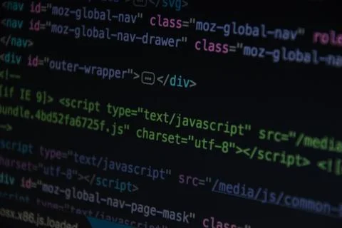Close up css HTML code on monitor screen with black background Stock Photos