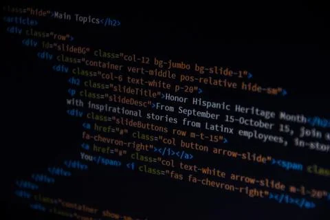 Close up css HTML code on monitor screen with black background Stock Photos