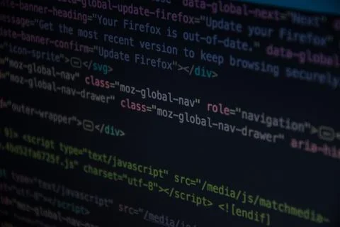 Close up css HTML code on monitor screen with black background Stock Photos