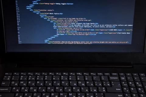 Close up css HTML code on monitor screen with black background Stock Photos