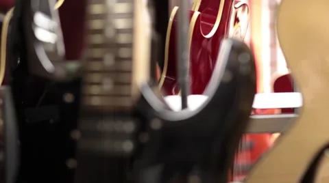 Close up CU electric guitar static rack focus Stock Footage 56035987