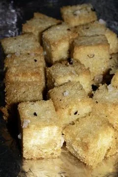 Close up of cubed fried bread croutons freshly made for soup Фото