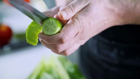 Close up of a cucumber being peeled Stock Footage 84281210