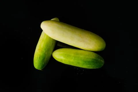 Close up Cucumber on black Stock Photos