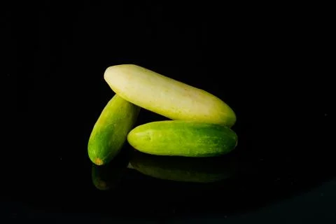 Close up Cucumber on black Stock Photos