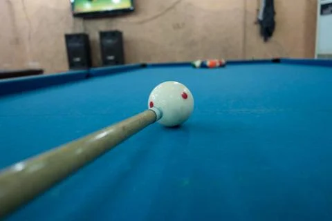 Close-up of a cue ball on a pool table in a recreational setting Stock Photos