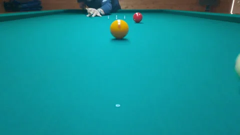 Close-up cue strike on billiard table during dynamic nine-pin game Stock Footage 322609442