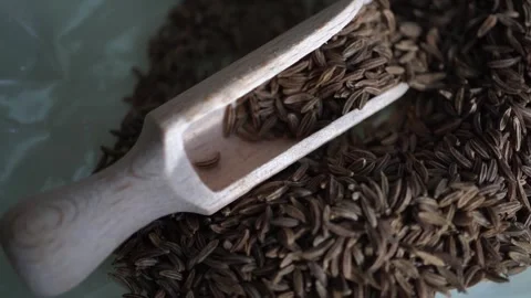 Close-up of cumin seeds in a bag with an old shovel Video stock 329467705