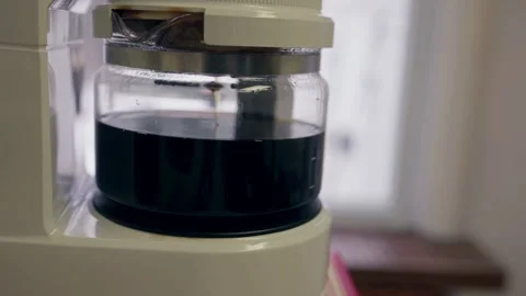Close up cup automatic coffee maker caffeine working filtration in footage HD Video stock 336585310