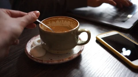 Close up cup of coffee and hand stir sugar Stock Footage 104516106