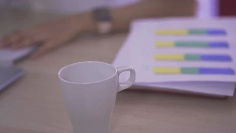 Close up of A cup of coffee on the computer desk Stock Footage 133030351