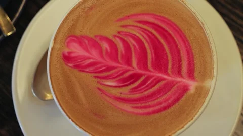 Close up of cup of coffee with latte art. Latte art service cafe. Creatively Stock Footage 324099167