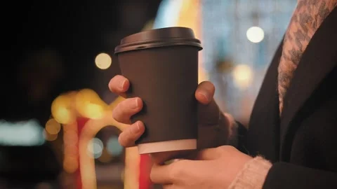 Close-up cup with delicious coffee in hands of fashionable young woman Stock Footage 280269411