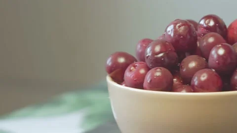 Close up of a cup of fresh cherry and raspberry on cutting board Stock Footage 134069449