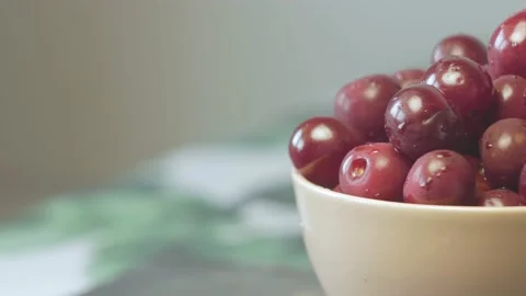 Close up of a cup of fresh cherry on cutting board Stock Footage 134069410