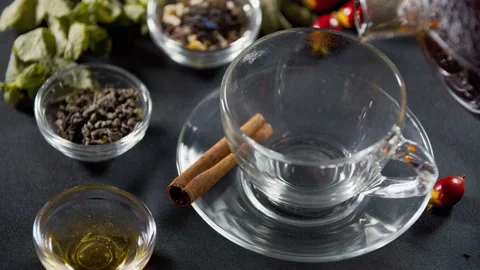 Close up of a cup with fresh hot tea pouring into it, hot beverage, 4k Stock Footage 141571985