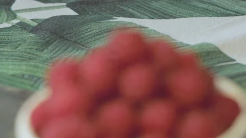 Close up of a cup of fresh raspberry on cutting board Stock Footage 134069446