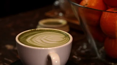 Close-up of cup of latte matcha coffee, spining loop Stock Footage 71025912