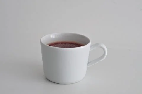 Close up cup of red tea isolated on white background Stock Photos