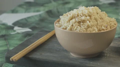 Close up of cup of rice cup of soy sauce and chopsticks Stock Footage 134069484