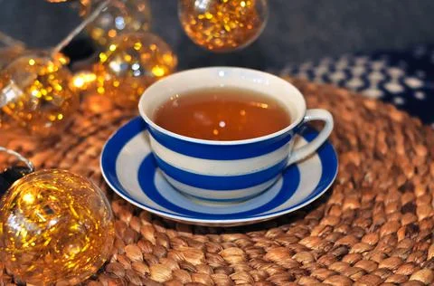 Close up of cup of tea with blue stripes at home ,teatime and relax Stock Photos