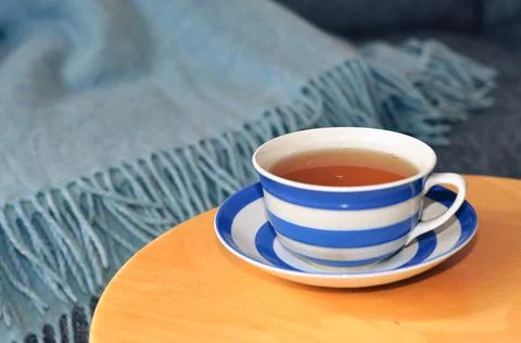 Close up of cup of tea with blue stripes at home ,teatime and relax Stock Photos