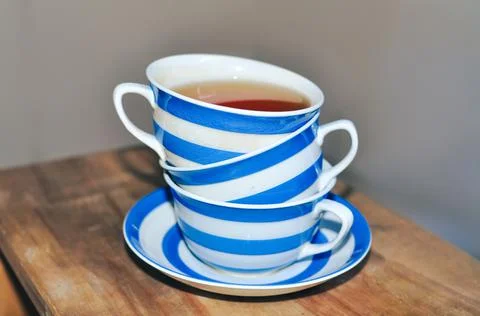Close up of cup of tea with blue stripes at home ,teatime and relax Stock Photos