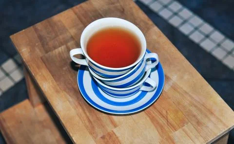 Close up of cup of tea with blue stripes at home ,teatime and relax Stock Photos