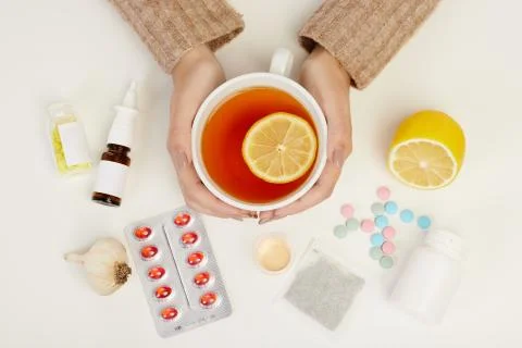Close-up of a cup of tea with a lemon slice shot on the white backgrounds. Stock Photos