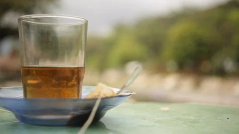 Close up of a cup of tea in an outdoor setting Stock Footage 107655465