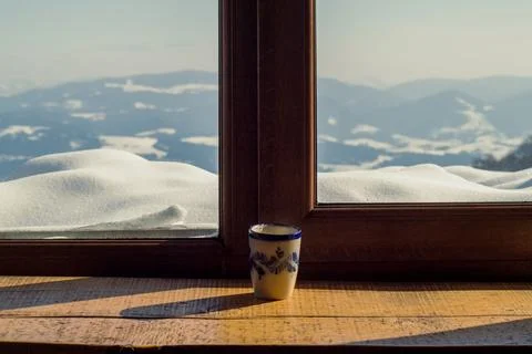 Close up cup on window sill concept photo Stock Photos