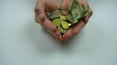 Close up of cupped hands with small coins. Small money offer Stock Footage 282662875