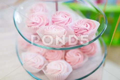 Close up of custard sweets on glass serving tray Stock Photos
