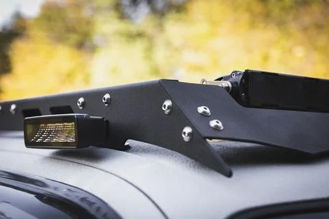 Close up of custom LED side light bar on roof rack off road suv vehicle Stock Photos