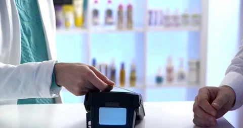 Close-up customer hand uses smartphone to make a wireless payment nfc technology Stock-Footage 336585677