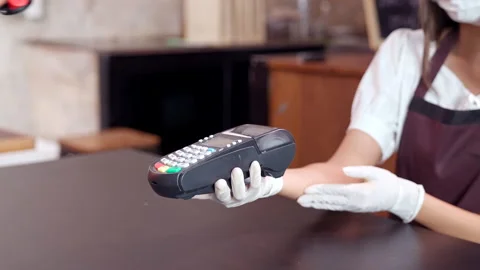 Close up Customer make contactless payment using smart watch. 4K Dolly shot Stock Footage 144390240