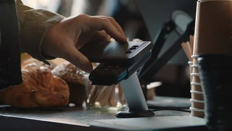 Close up customer making contactless payment using smartphone mobile money Stock Footage 103478918