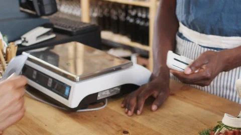 Close Up Of Customer Making Contactless Payment For Shopping At Checkout Of Video stock 111931371
