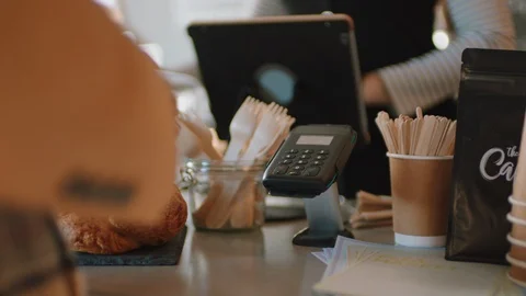 Close up customer paying using credit card contactless payment spending money in Stock Footage 103472722